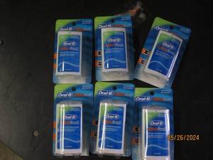 box of 6 oral B ultra floss...