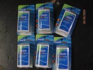 box of 6 oral B ultra floss...
