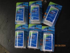 box of 6 oral B ultra floss...