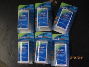 box of 6 oral B ultra floss...