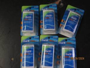 box of 6 oral B ultra floss...