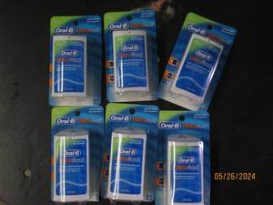 box of 6 oral B ultra floss...