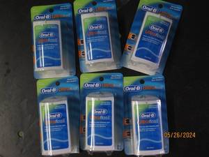 box of 6 oral B ultra floss...