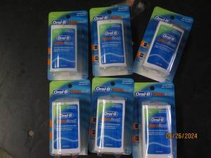 box of 6 oral B ultra floss...