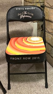 lot 30 image: Pair of First Row 2015 Stevie Wonder Padded Folding Chairs from the Songs in the Key of Life Performance