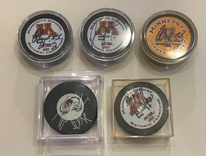 lot 17H image: 5 Signed Hockey Pucks with JSA COA - David Aebischer, (2) Adam Hauser, Jeff Taffe, Jordan Leopold - 2002 University of Minnesota NCAA Champions