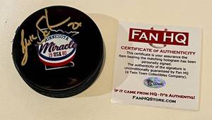 lot 64B image: Buzz Schneider Signed 1980 Minnesota Miracle Hockey Puck with Fan HQ COA - 1980 Miracle on Ice Olympics