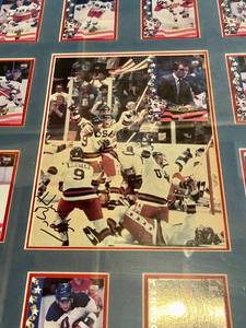 lot 2B image: Miracle on Ice 1980 Olympic Team w Herb Brooks Auto - Uniquely framed  20 player cards and Herb Brook card from the 1 of 24,000 Signature Rookies Hockey cards  Copyright 1995  with Celebration photo in the middle signed by Herb Brooks