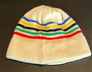 lot 8 image: 1980 XIII Winter Olympic Games Lake Placid Blue Stanley Winter Hat - white with colored strips and tassel