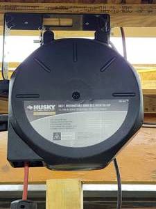 lot 55 image: Husky 50 ft Retractable Hanging Extension Cord Reel