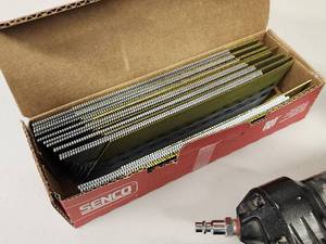 lot 109 image: Senco Finish Pro 35 15 Gauge Angled Finish Nailer Air Tool with a Partial box of Nails
