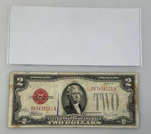 lot 7 image: 1928 F U.S. Two Dollar Red Seal In Protective Sleeve