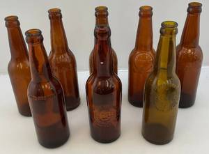lot 132 image: Misc. Antique Embossed Amber Glass Beer Bottles