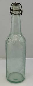lot 141 image: Antique Embossed Clear Glass Schmidt Beer Bottle