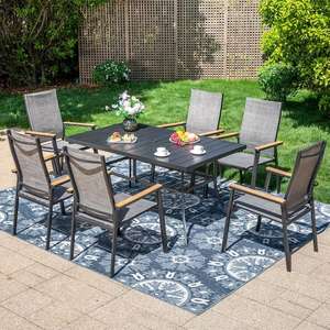 lot 128 image: Black 7-Piece Metal Outdoor Patio Dining Set with Rectangle Table and Stackable Aluminum Chairs
