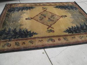lot 17 image: Large woodsy themed area rug...