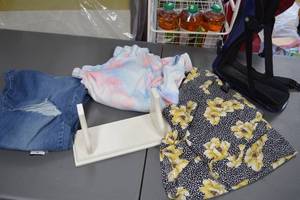 lot 29 image: Lot of Clothing Items Buffalo David Bitton Hi Rise Jeans, APT.9 Floral Top, and Tie-Dye Sweater