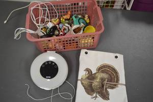 lot 141 image: Lot of Home Decor Items including Figurines, Digital Scale, and Apron