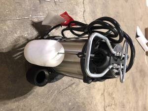 lot 37 image: RIDGID 13 HP Stainless Steel Dual Suction Sump Pump   Customer Returns See Pictures