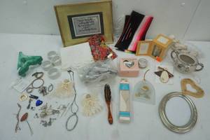 lot 15 image: jewelry Findings, dresser collectables, Napkin ring holders, vintage hair clips, massager and more