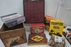 lot 23 image: James Sadler & Sons LTD Ceramic Tea Pot, Apple Crate, Home Interior Alphabet, Wing it Game and Rig N Jig, Lewis is Clark  game, Frontier Days Craft Kit