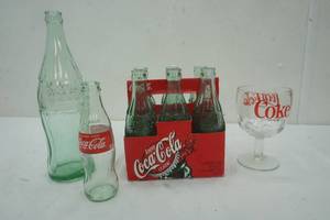 lot 209 image: Variety of Coca- Cola Bottles, Stem Glass and measuring spoons