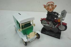 lot 252 image: Fuller Brush Metal Bank and a Born to Loose Bobble Figure
