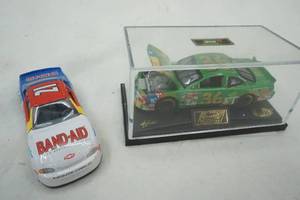 lot 280 image: Revell collection M & M 164 model car, and Band Aid car