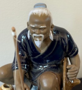 lot 52 image: Chinese Ceramic Mudman Fisherman Figurine