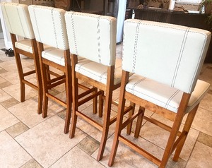 lot 2 image: Creamy White Faux Leather & Wood Bar Stools (Set of 4)