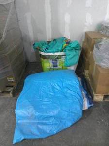 Pile of mixed condition Pool Floats and Slides