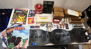 lot 10 image: Vintage Pokemon, Naruto, Velvet Tin Can, Dutch Masters Cigar Box, Vintage transparent marbles and more