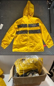 lot 16 image: New Hooded Yellow Rain Jackets marked Minnesota. Sizes are (2) Large (1) 2XL (2) XL