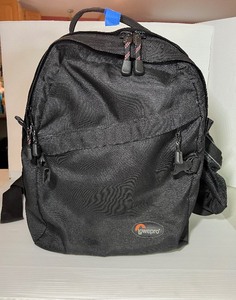 lot 34 image: LowePro Mini Trekker Bag, measures 13 W X 7.5 D X 16 H