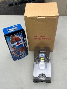 lot 59 image: Limited Edition Jeff Gordon Pepsi 2003 Racing Program model car in tin