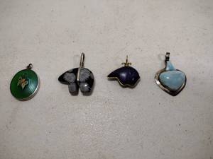 lot 92 image: (4) Pendants set in sterling.&nbspLapis Navajo, Snowflake Obsidian, Larimar,&nbspLundberg Studios Sterling.