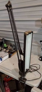 lot 104 image: Swing Arm Work Lamp clamps to table or bench, corded. Not tested.