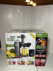 lot 132 image: New Ninja Never Clog Cold Press Juicer