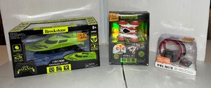 lot 133 image: Brookstone RC Power Boat Brookstone  Mini-stunt RC Vehicle Ring racer