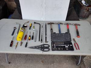 lot 203 image: BernzOmatic torch, Lugnut wrench, adjust. wrench, screwdrivers, chisel, handheld worklight, hammers, pry bar, socket set, pliers