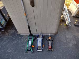 lot 161 image: Black, green, and blue car floor jacks with gray handle. Pittsburgh 1.5-ton, Daytona 1.5-ton