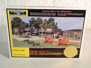 lot 8 image: DESIGN PRESERVATION MODELS N SCALE DPM GOLD EDITION OLSEN FEEDS & LARSENS IMPLEMENT #661 - IN BOX - FANTASTIC PIECE - SEE PICTURES