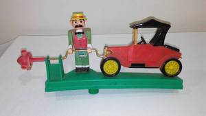 Vintage 1984 Art Line Whirl-A-Gig Man Starting Car Lawn Ornament.