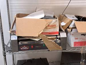 lot 215 image: Contents of Shelf - Olde Midway Pro30 Hot Dog Machine, Box of Misc. Spare Parts