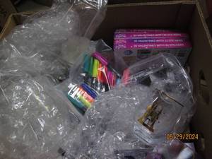 box of glasses , valentines and highlighters