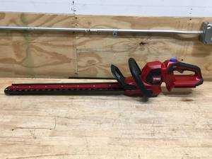 lot 5 image: New Toro 60V MAX 24 in. Hedge Trimmer with 2Ah Battery And Charger Model # 51840