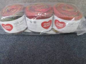 lot 36 image: Red Heart Roll with It Melange Catw...