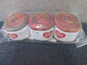 lot 37 image: Red Heart Roll with It Melange Catw...