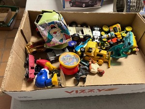 Tote full of vintage toys