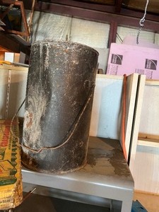 Vintage cans and grease barrel